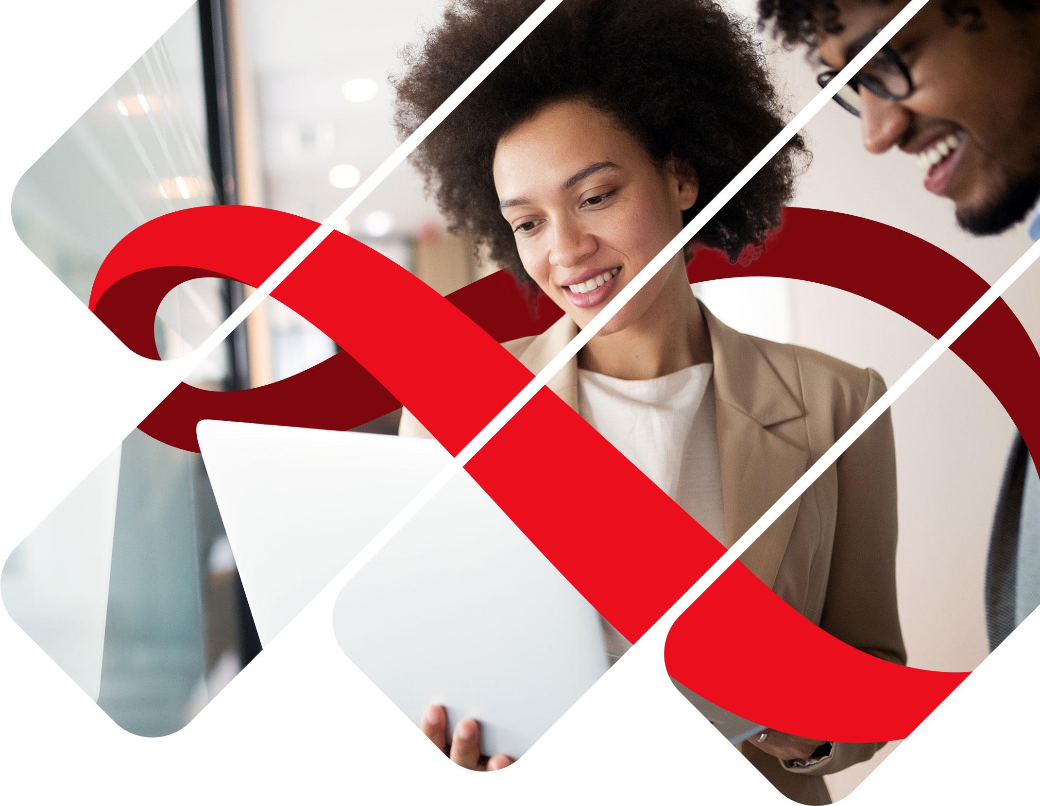 Two people training on a laptop in the office