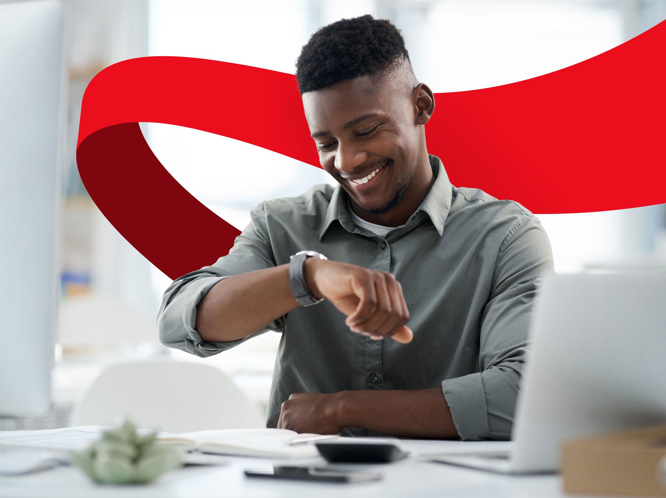 Professional male looking at his watch and feeling productive and organized