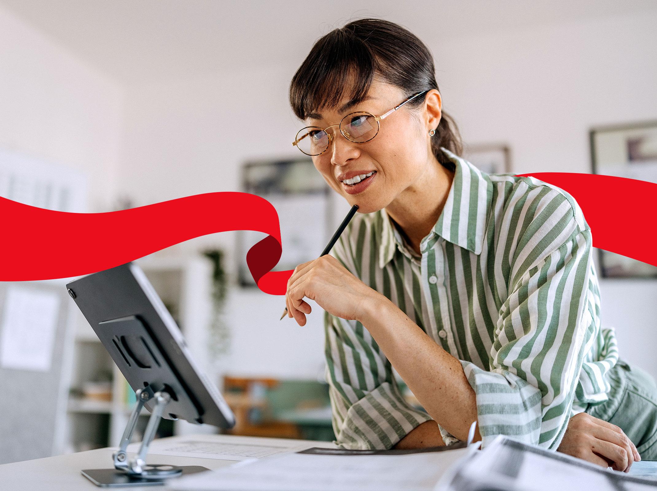 Business professional using AI on computer and phone to be more productive