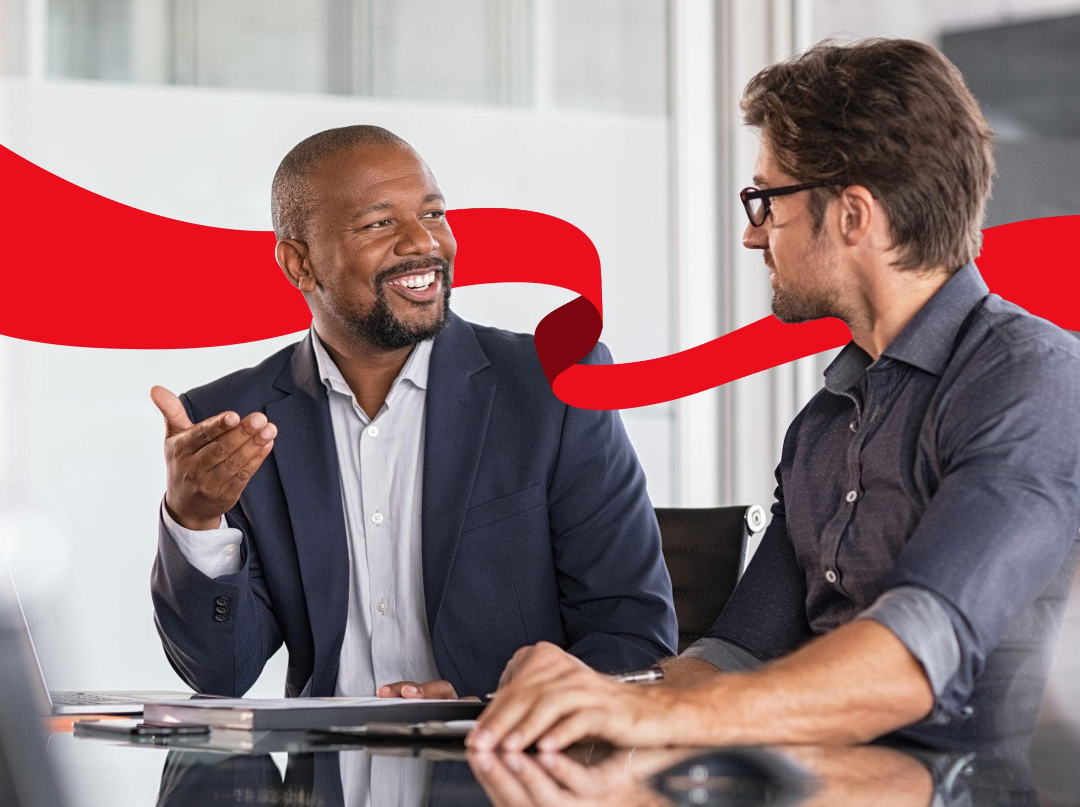 Emotionally intelligent man speaking to a coworker