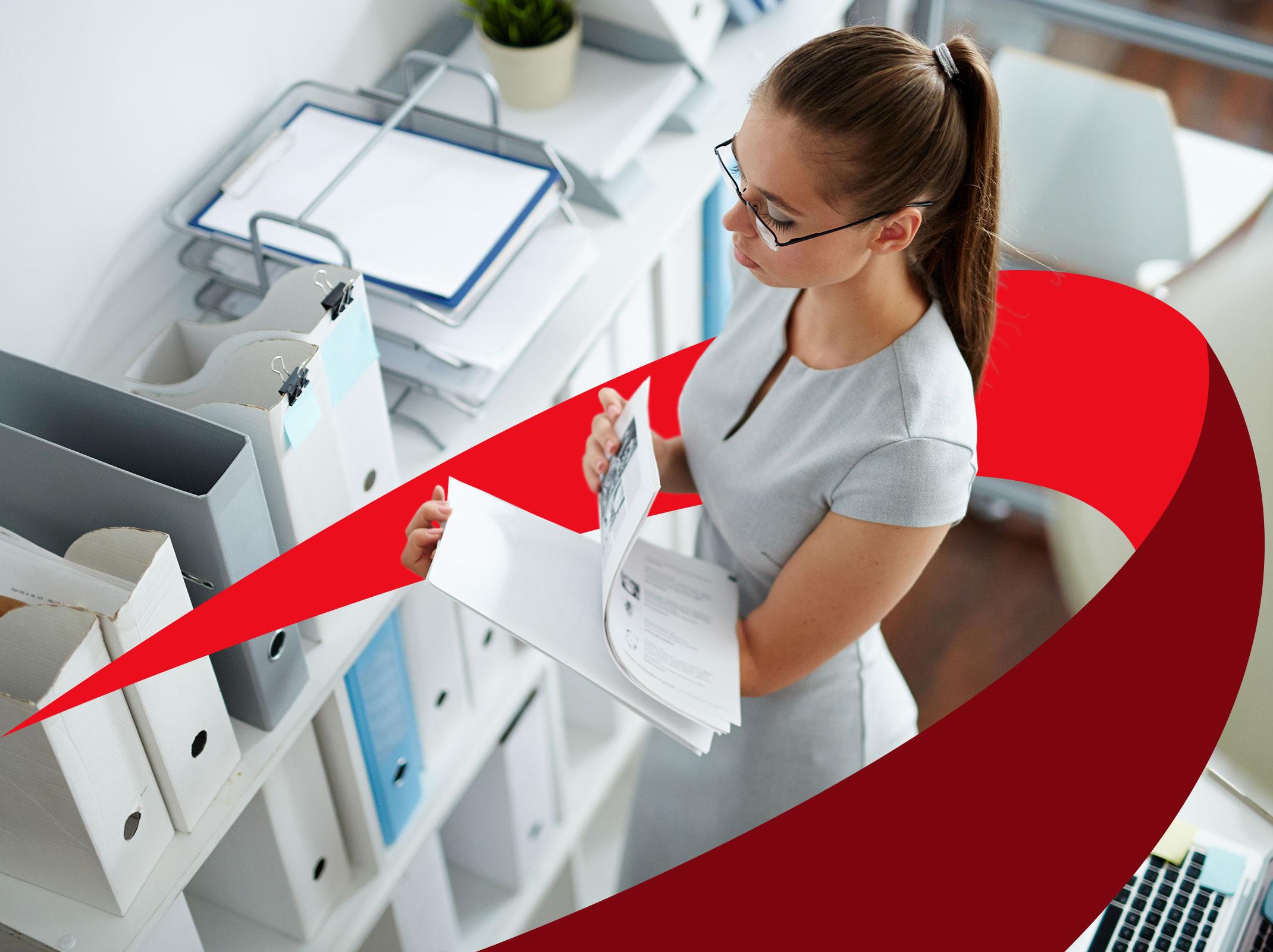 Business professional organizing a large amount of files